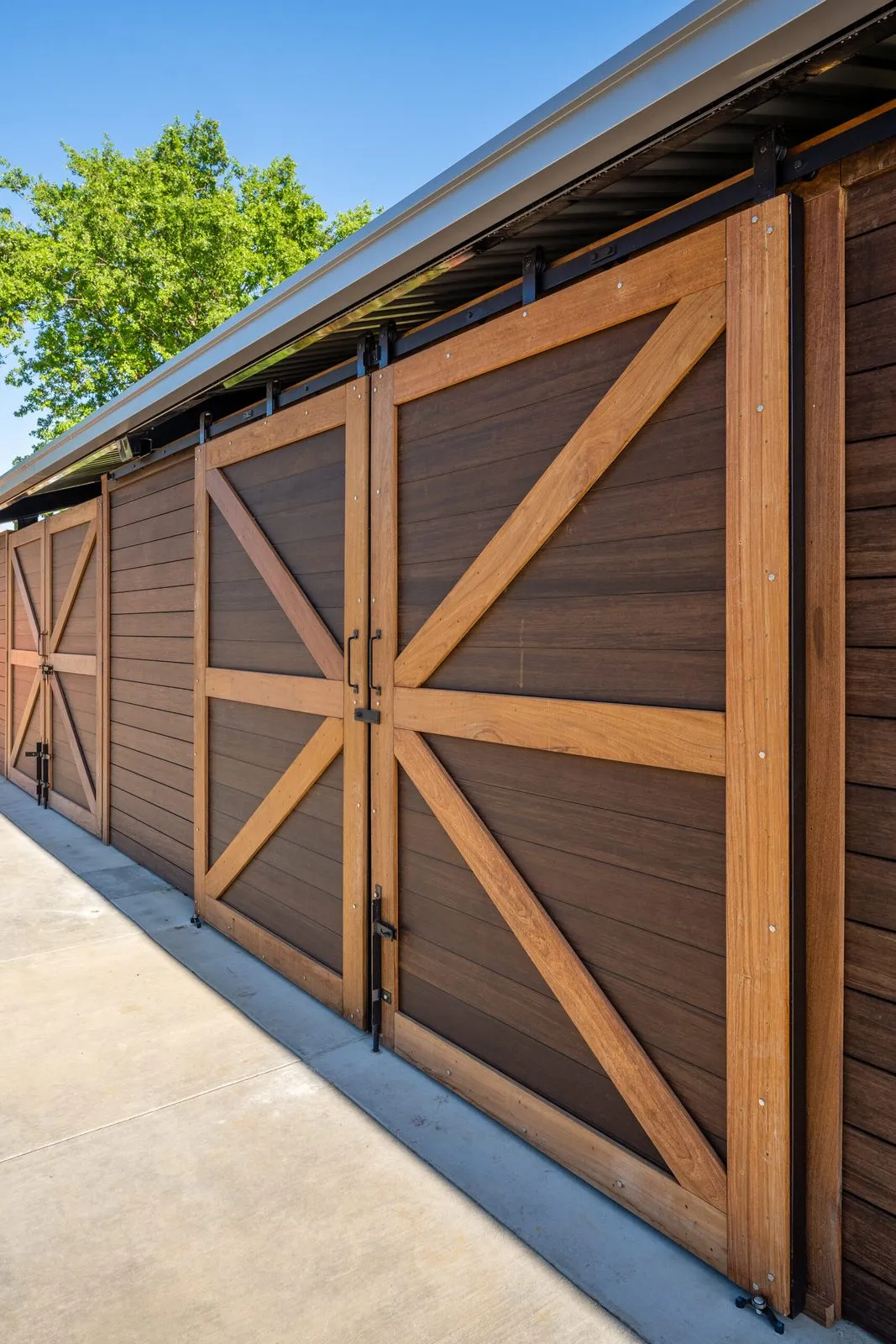 Wood barn doors on the shade structure