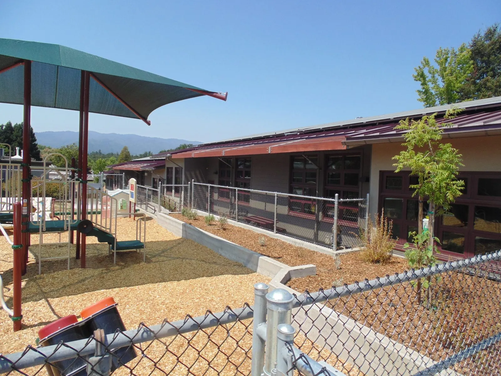 Play area with shade structure